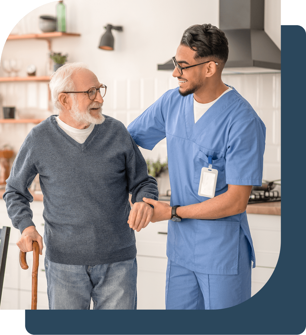 Caregiver supporting elderly man indoors